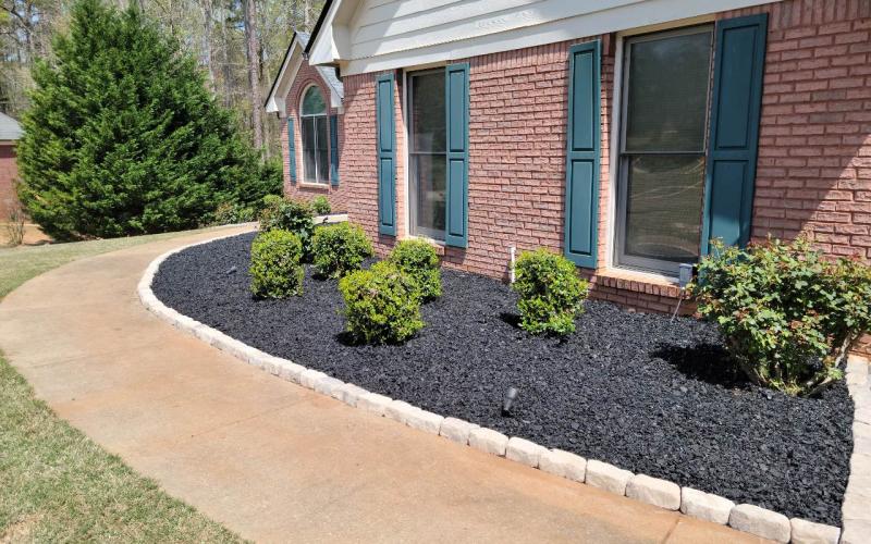Black Rubber Mulch Landscaping with Green Shutters