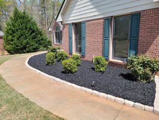 Black Rubber Mulch Landscaping with Green Shutters